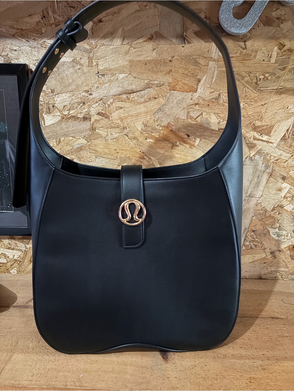 lululemon athletica Black Shoulder Bag with Gold Emblem